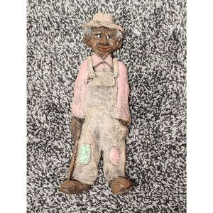 Man wearing overalls Figurine